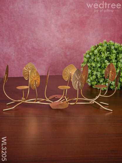 Candle Holders among Lotus Stems & Leaves