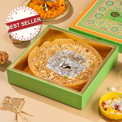 Ghewar 6-inch by Dadus with BEST SELLER badge, silver leaf and pistachio topping in green presentation gift box