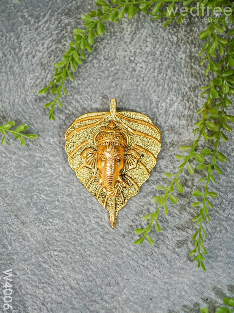 White Metal Wall Hanging Ganesha face on leaf  - Gold Finish