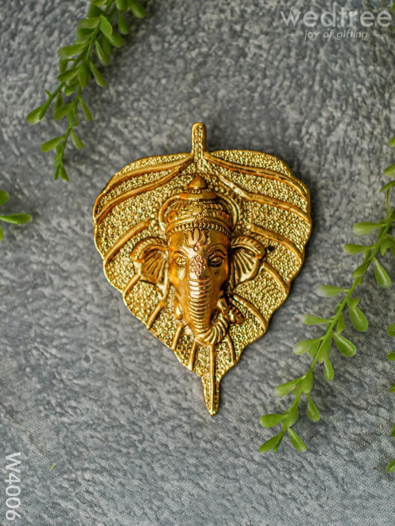 White Metal Wall Hanging Ganesha face on leaf  - Gold Finish