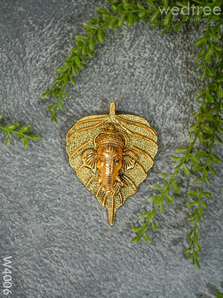 White Metal Wall Hanging Ganesha face on leaf  - Gold Finish