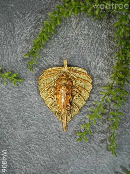 White Metal Wall Hanging Ganesha face on leaf  - Gold Finish