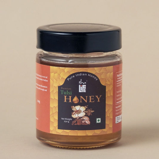 Tulsi Honey (250gm). Processed and filtered. Honey mixed with Tulsi extracts. High in medicinal value. Suggested for cold related symptoms. Good for Immunity.
